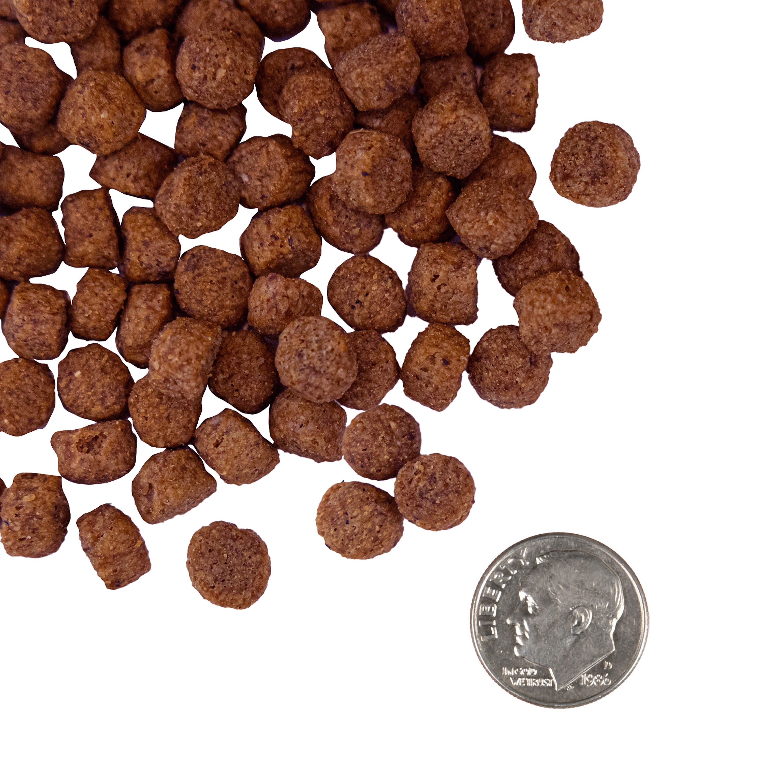 A small pile of Nutritionals Digestive Support Low Fat Chicken & Oatmeal Recipe kibble next to a dime for scale.