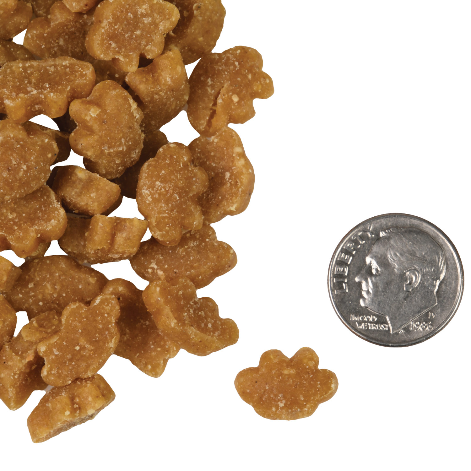 A small pile of PurrSnackitty Chicken Flavor Snackitties treats next to a dime for scale.