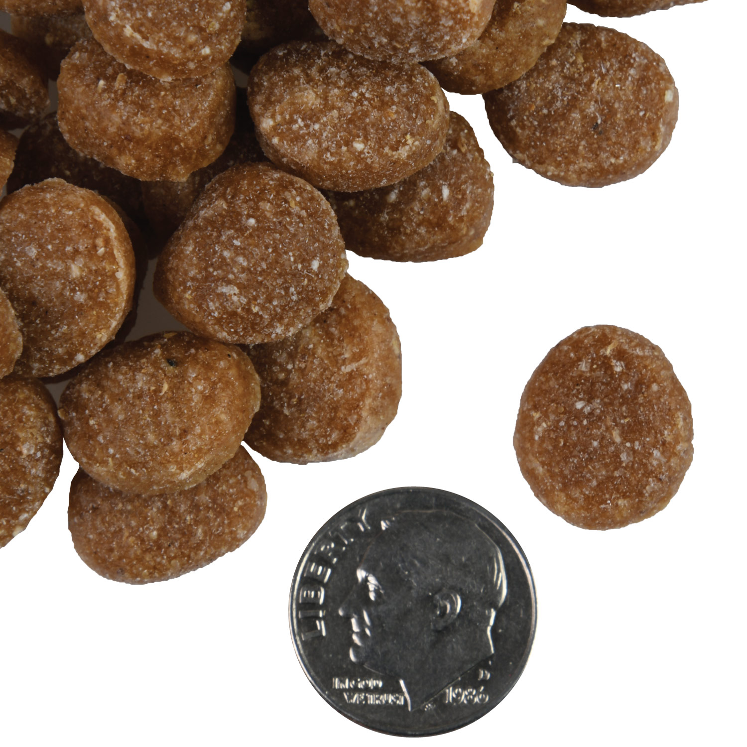 A small pile of Tenderollies Bac'n Chedd-a-Rollie Flavor Dog treats next to a dime for scale.