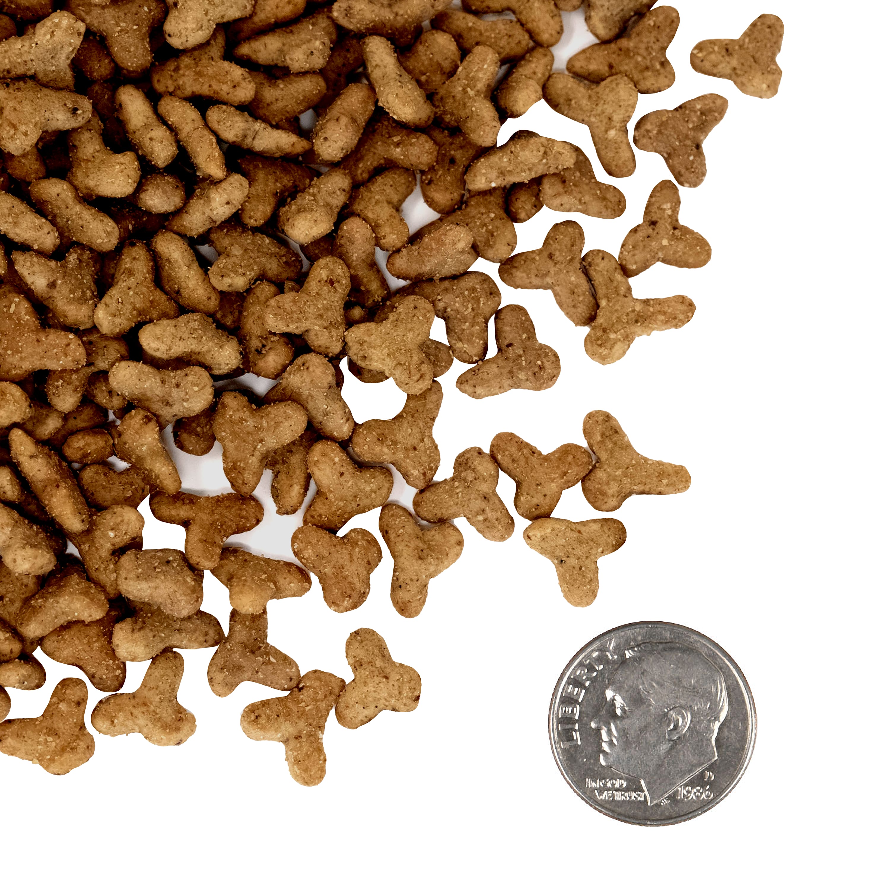 A side-by-side size comparison of PurrSnickitty Chicken Delight dry cat food kibble next to a U.S. dime